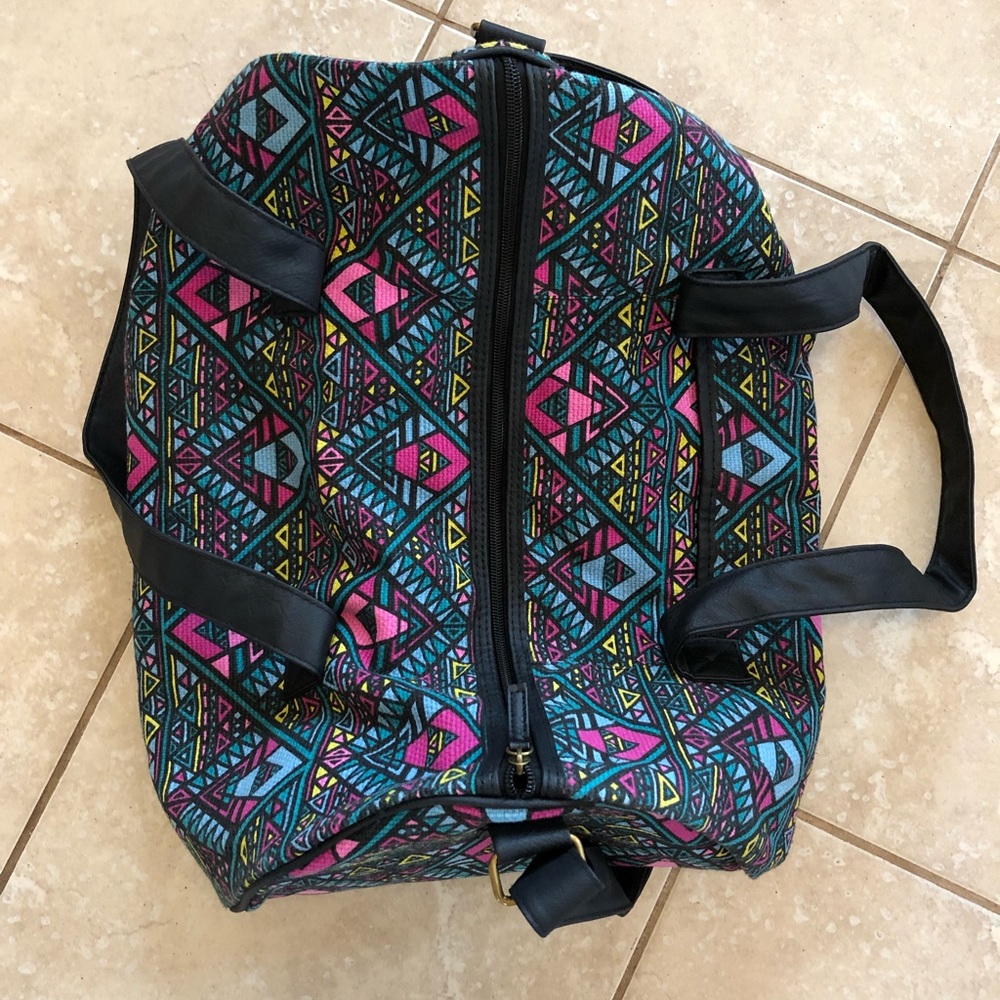 Multicoloured tribal print duffel bag.